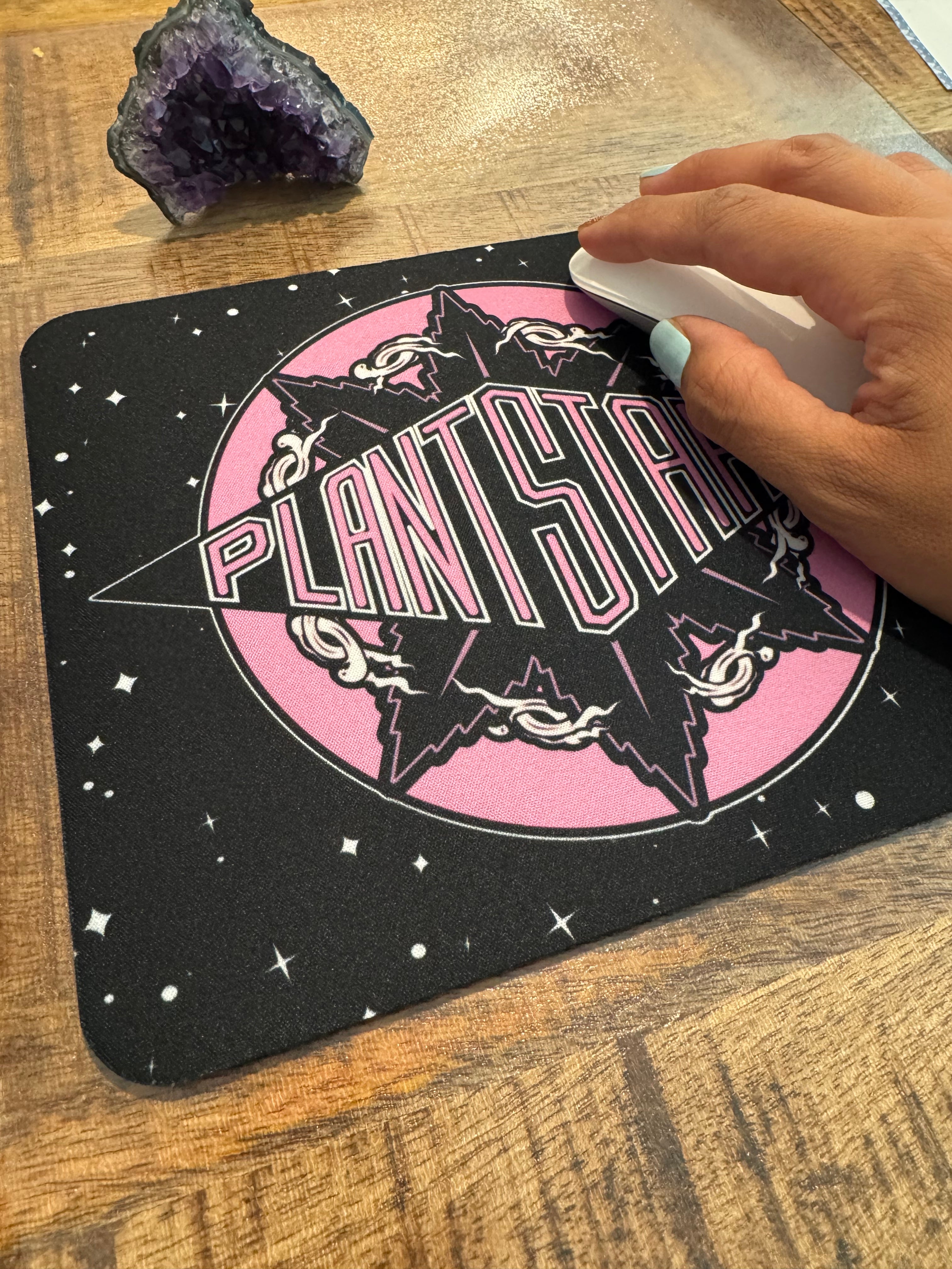 Mouse pad with a star design and 'Playtime' text on a wooden surface